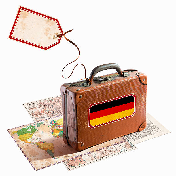 istock Antique leather suitcase on different maps Germany flag 469895793