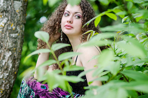 istock Beautiful woman outdoors in summer forest 469897842