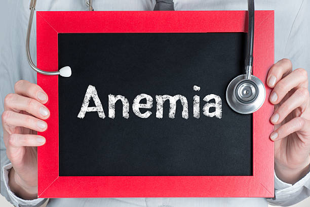 anemia Doctor shows information on blackboard: anemia anemia stock pictures, royalty-free photos & images