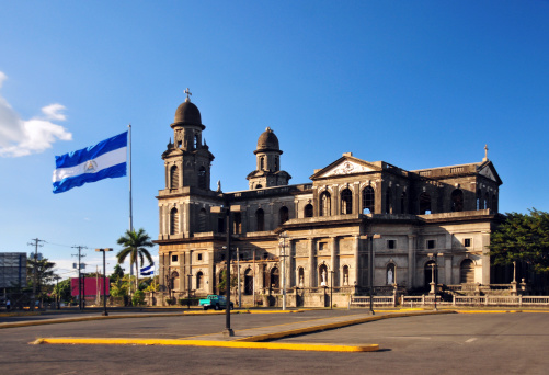 Managua, Nicaragua: Antigua catedral y bandera de nicaragua photo