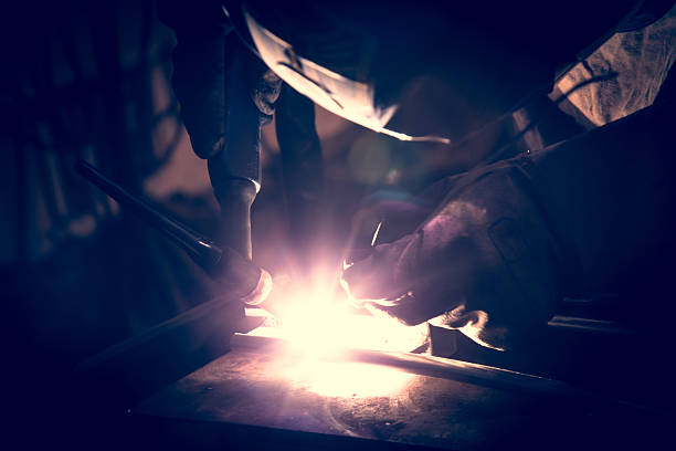 istock Employee welding aluminum using TIG welder. 469898966