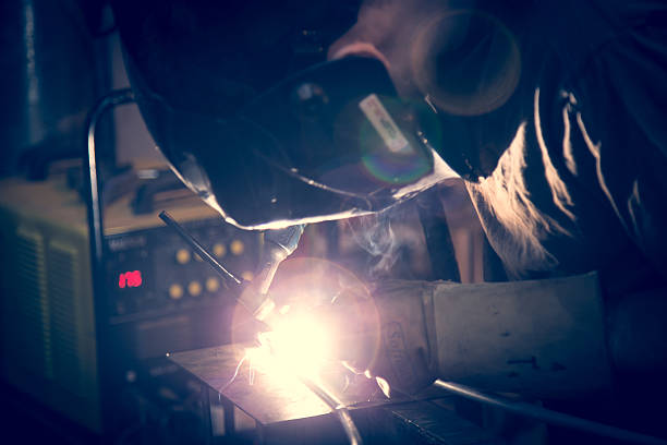 istock Employee welding aluminum using TIG welder. 469899002