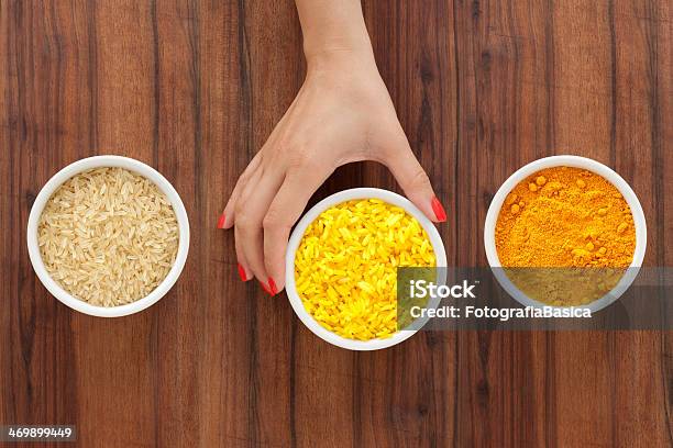 Making Yellow Rice Stock Photo - Download Image Now - Ground - Culinary, Activity, Adult