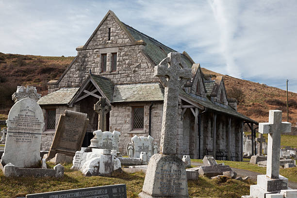 st tudno church, лландудно. уэльс, на огромный orme. - wales stone cross religion стоковые фото и изображения