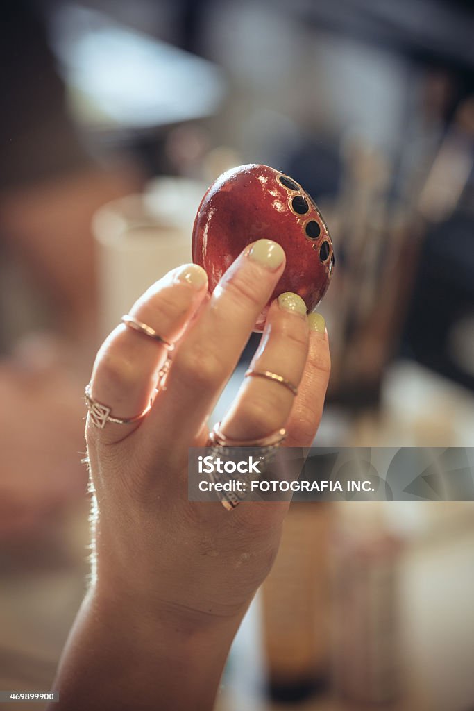 Homemade Easter egg Female hand holding a hand painted Easter egg. 2015 Stock Photo