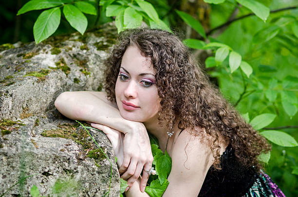istock Beautiful woman outdoors in summer forest 469900042