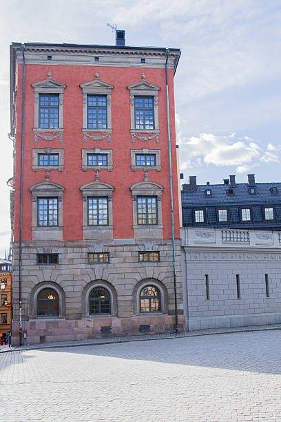 istock Red Building Standing Against Blue Sky in Old Town 469900510