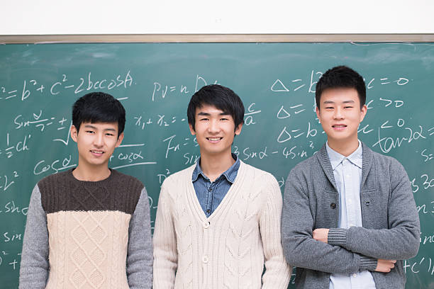 istock group  college students standing in front of a blackboard 469900525