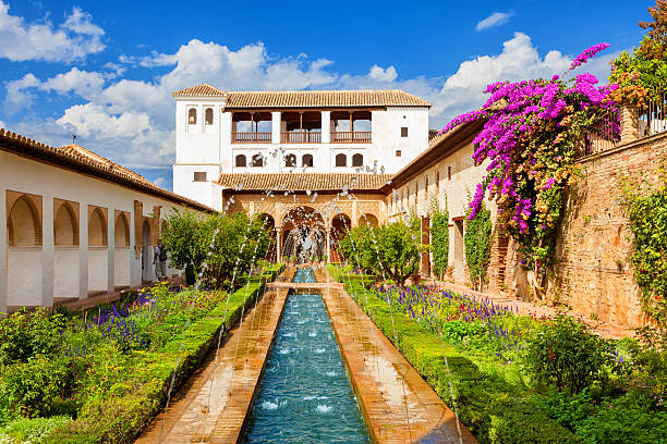The Generalife of Alhambra de Granada Granada, Spain - October 3, 2013: General view of the Generalife with its famous fountain and garden. Alhambra de Granada. UNESCO World Heritage Site granada stock pictures, royalty-free photos & images