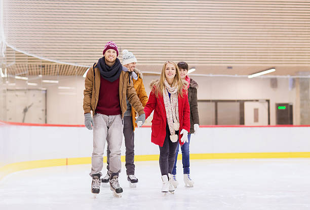 istock happy friends on skating rink 469901982
