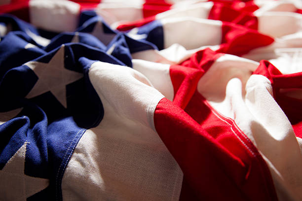 istock American flag with folds. Side view. Dramatic lighting. Patriotism. 469902396