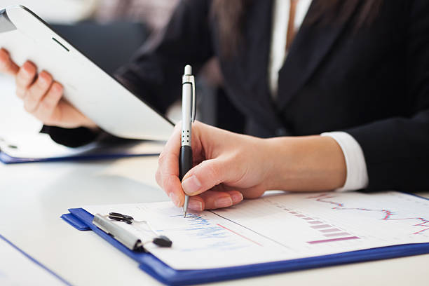 istock Woman writing notes during a meeting 469902460