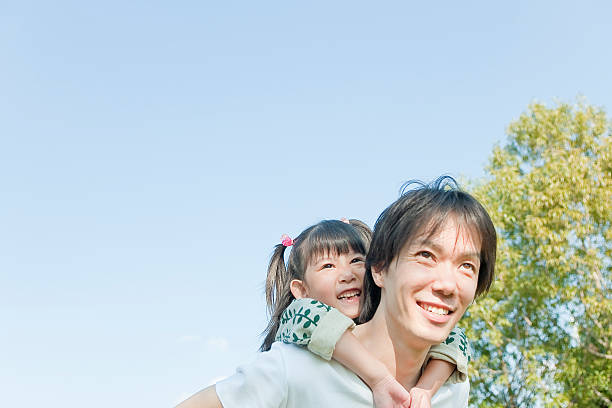 istock Father who carries a child on his back 469903191