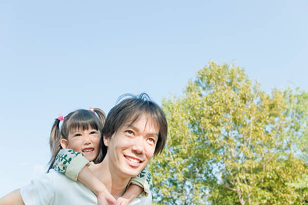 istock Father who carries a child on his back 469903209