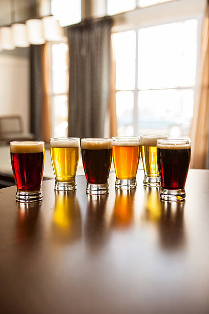istock Bar with six glasses of beer samplers on it. 469903358
