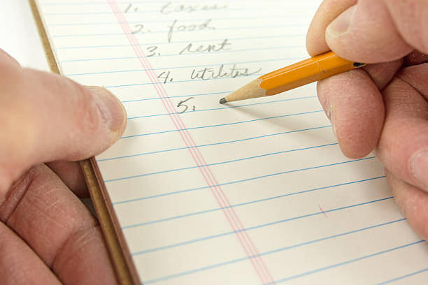 istock Individual's personal view  working on a budget sheet. 469903894