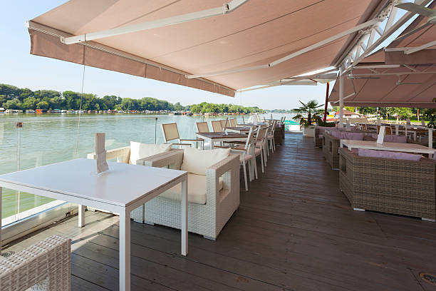 istock Modern riverside view of a cafe terrace 469903980