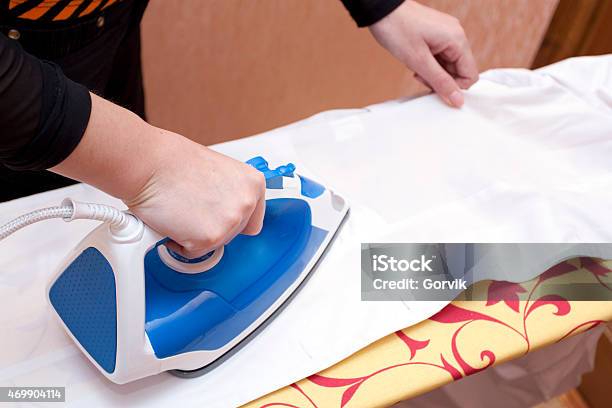 Process Of Ironing Of A White Dressing Stock Photo - Download Image Now - 2015, Backgrounds, Bathrobe
