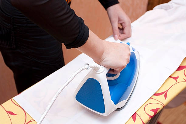 istock Process of ironing of a white dressing 469904120