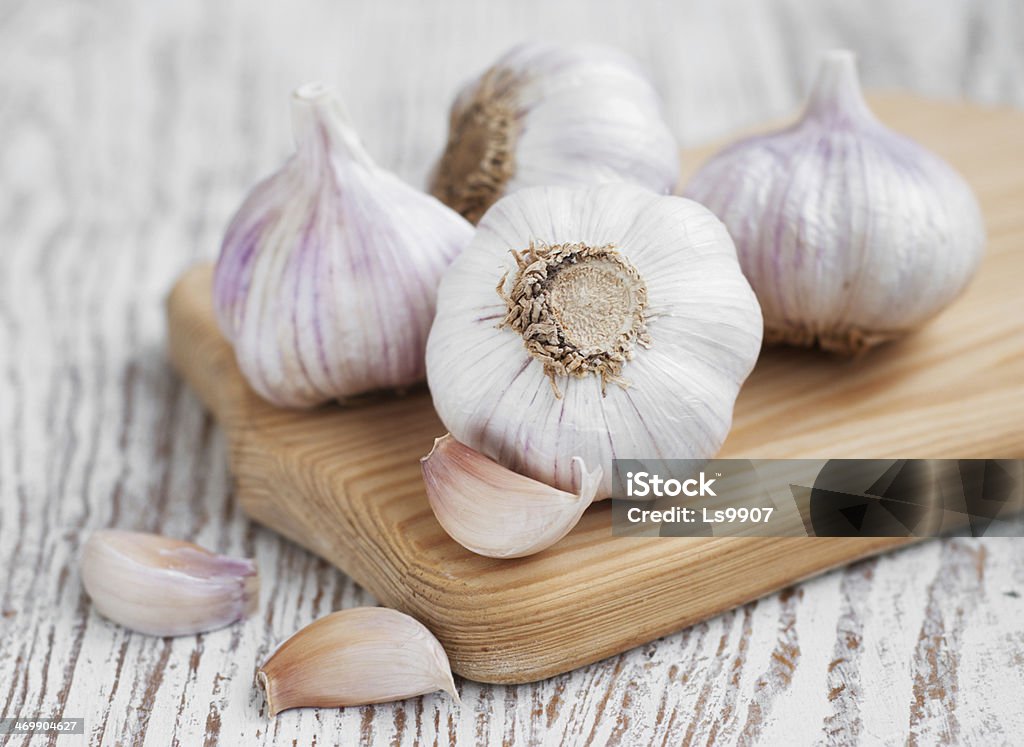 Garlic Garlic  on a old white wooden background Garlic Stock Photo