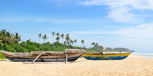 istock fishing boat on the sandy shore 469905398