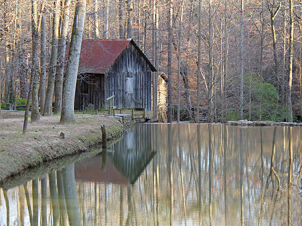 Historic Grist Mill - Georgia Historic Grist Mill with reflection in pond - Georgia burton sussex stock pictures, royalty-free photos & images