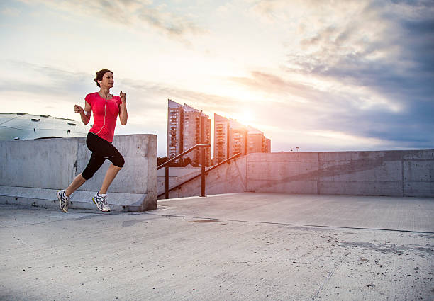 istock Young woman running 469906216
