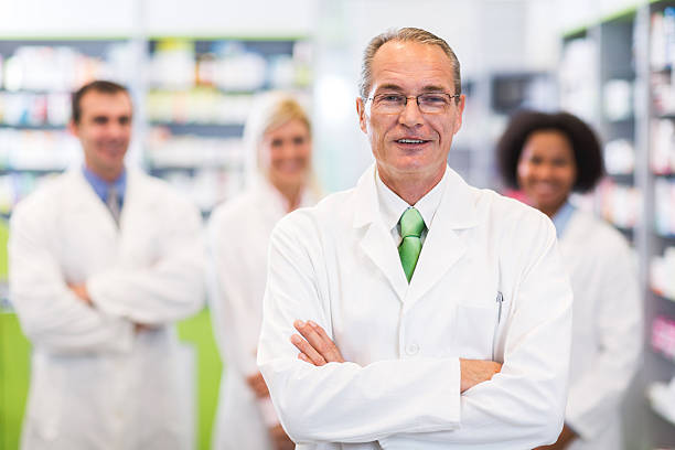 istock Mature pharmacist in pharmacy looking at camera. 469906218