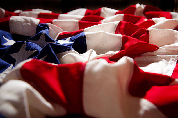 istock American flag with folds. Side view. Dramatic lighting. Patriotism. 469907160