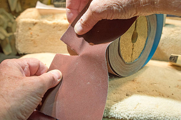 istock DIY- how to tear a piece of sandpaper from  roll. 469907852