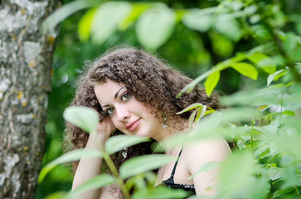 istock Beautiful woman outdoors in summer forest 469908346