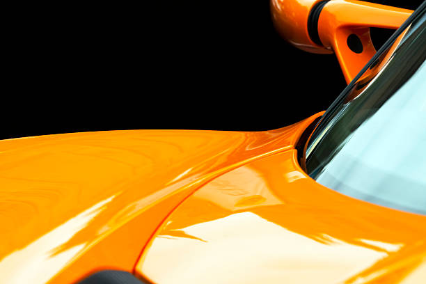 Sydney, Australia - January 26, 2014: Sydney College Street, celebrating Australia day, on Sydney streets was public display of cars. Closeup hood, front window and reversing mirror of orange Lotus  against black background, Lotus Cars is a British manufacturer of sports and racing cars.
