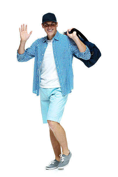 istock Happy young man waving hand 469910727