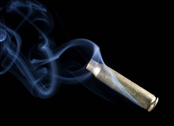 istock Rifle casing with smoke after a shot 469910836