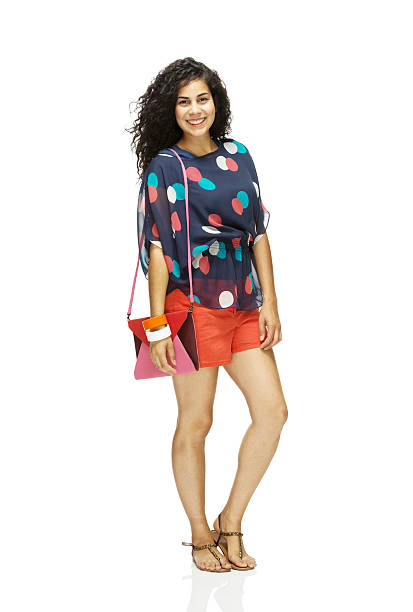 istock Cheerful woman standing with shoulder bag 469911459