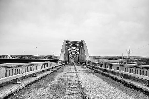 istock Decaying highway leading to old bridge 469912228