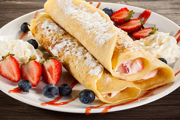 istock Pancakes with cream and fruits 469912330