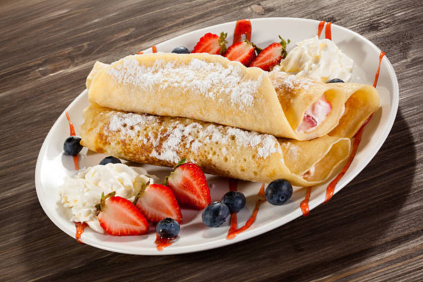 istock Pancakes with cream and fruits 469912572