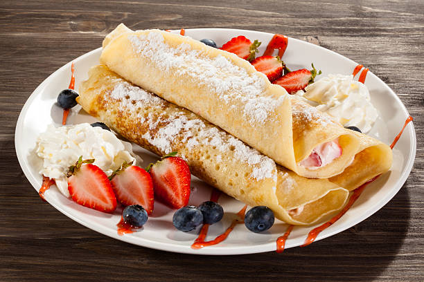 istock Pancakes with cream and fruits 469912574