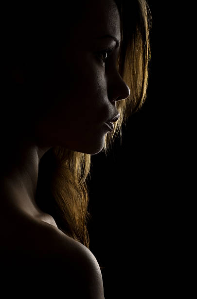 istock Dark portrait of a girl light. 469912582