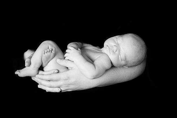 istock Father Holding Newborn Girl 469914435