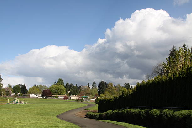 istock Clouds Forming Over Neighborhood Playground 469916898
