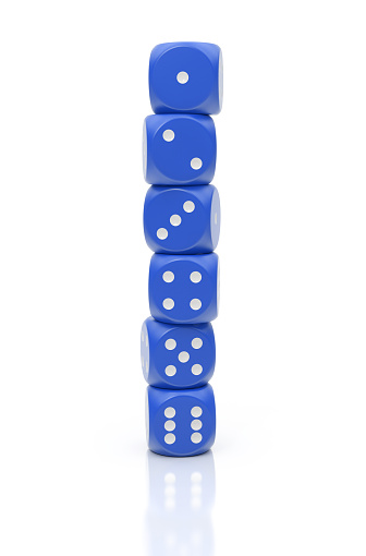 Blue dices stacked to a tower isolated on white background.