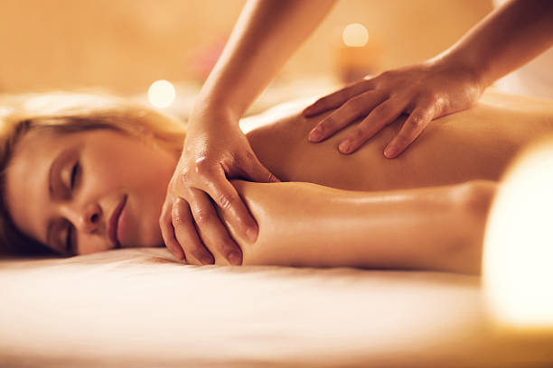 istock Woman receiving massage at the spa. 469917782