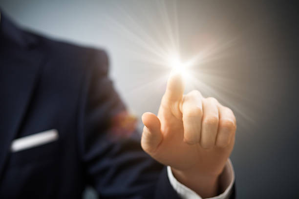 istock Businessman's finger pointing at shiny futuristic button 469917831