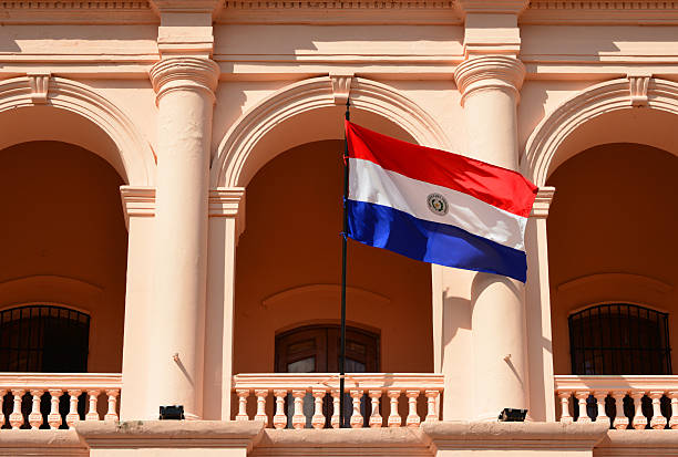 Asunción, Paraguay: flag of Paraguay at the Cabildo - neo-classical building designed by the Basque architect Pascual Urdapilleta, built in 1844 for the executive and legislative branches, latter housed the National Congress - photo by M.Torres