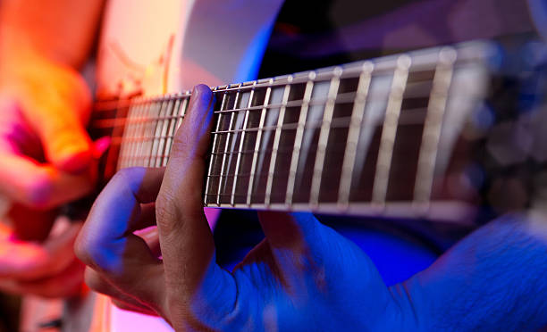 istock young male musician with a white guitar 469921770