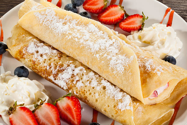 istock Pancakes with cream and fruits 469921954