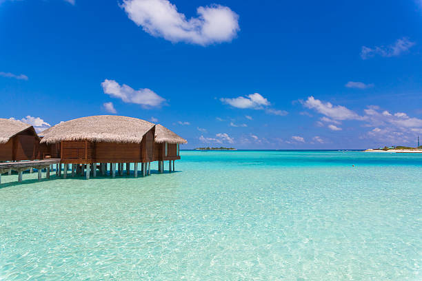 istock Over Water Bungalow in Maldives in a Sunny Day 469922200