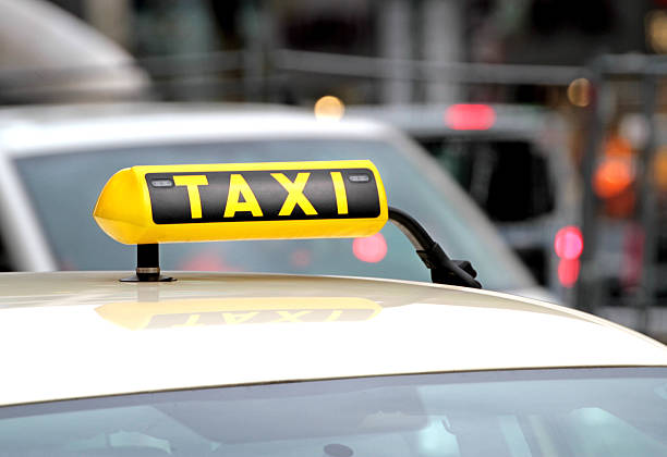 istock Taxi and traffic close up image 469922908